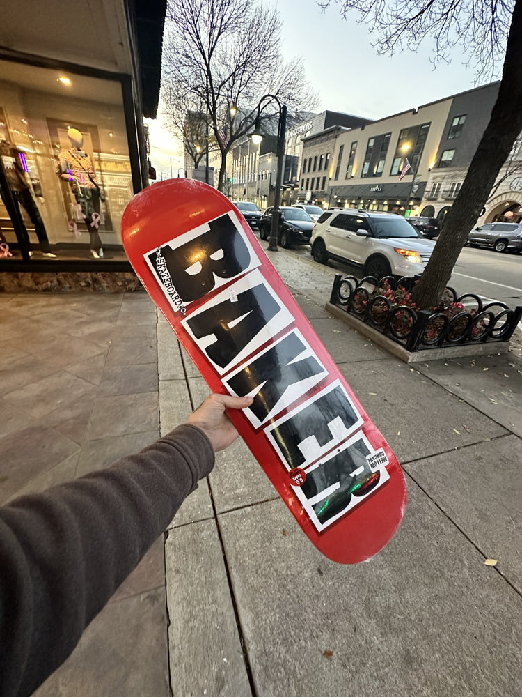 Red Baker deck held up inside Elements Boardshop